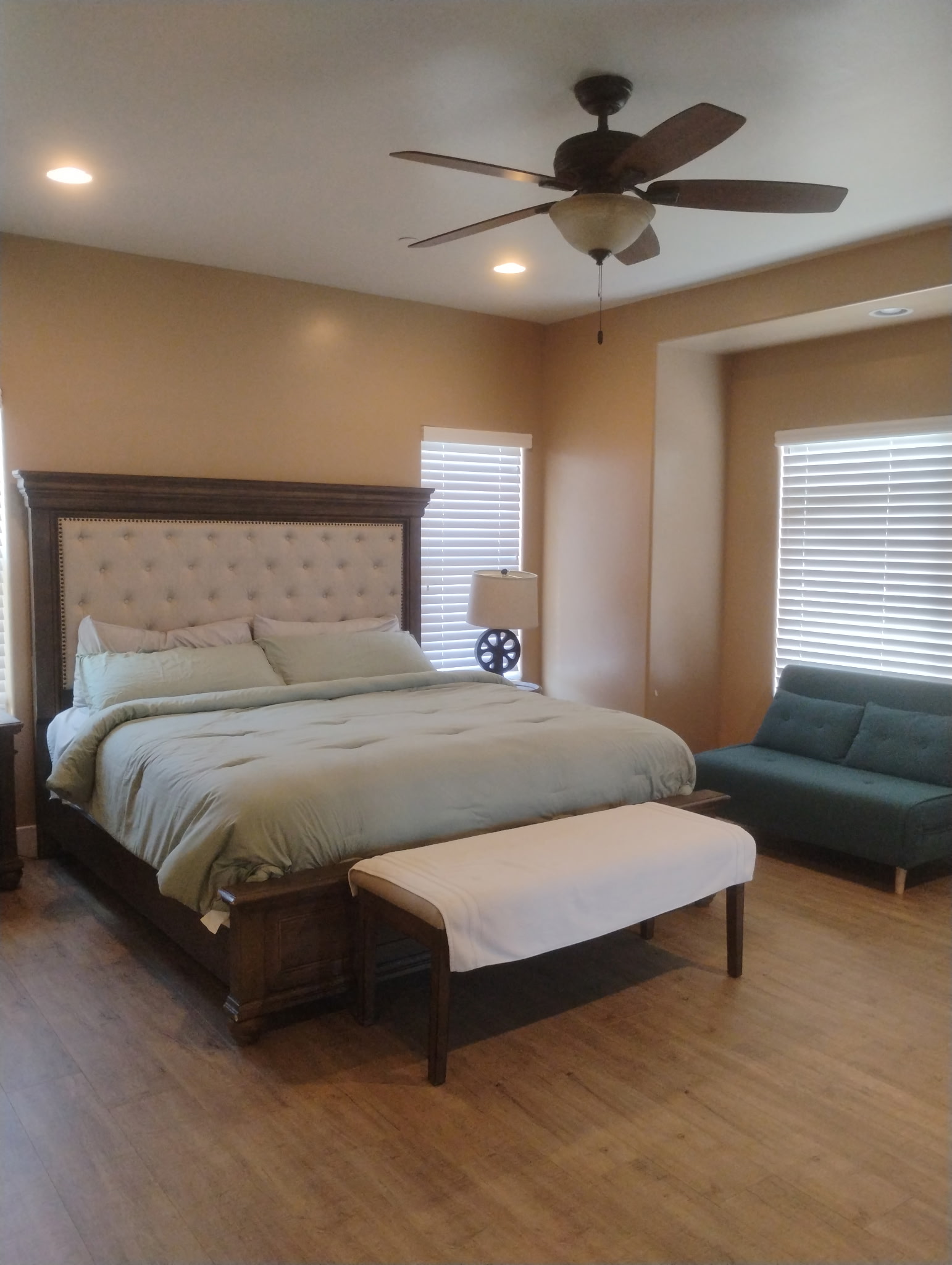 Freshly made bed in a spacious bedroom