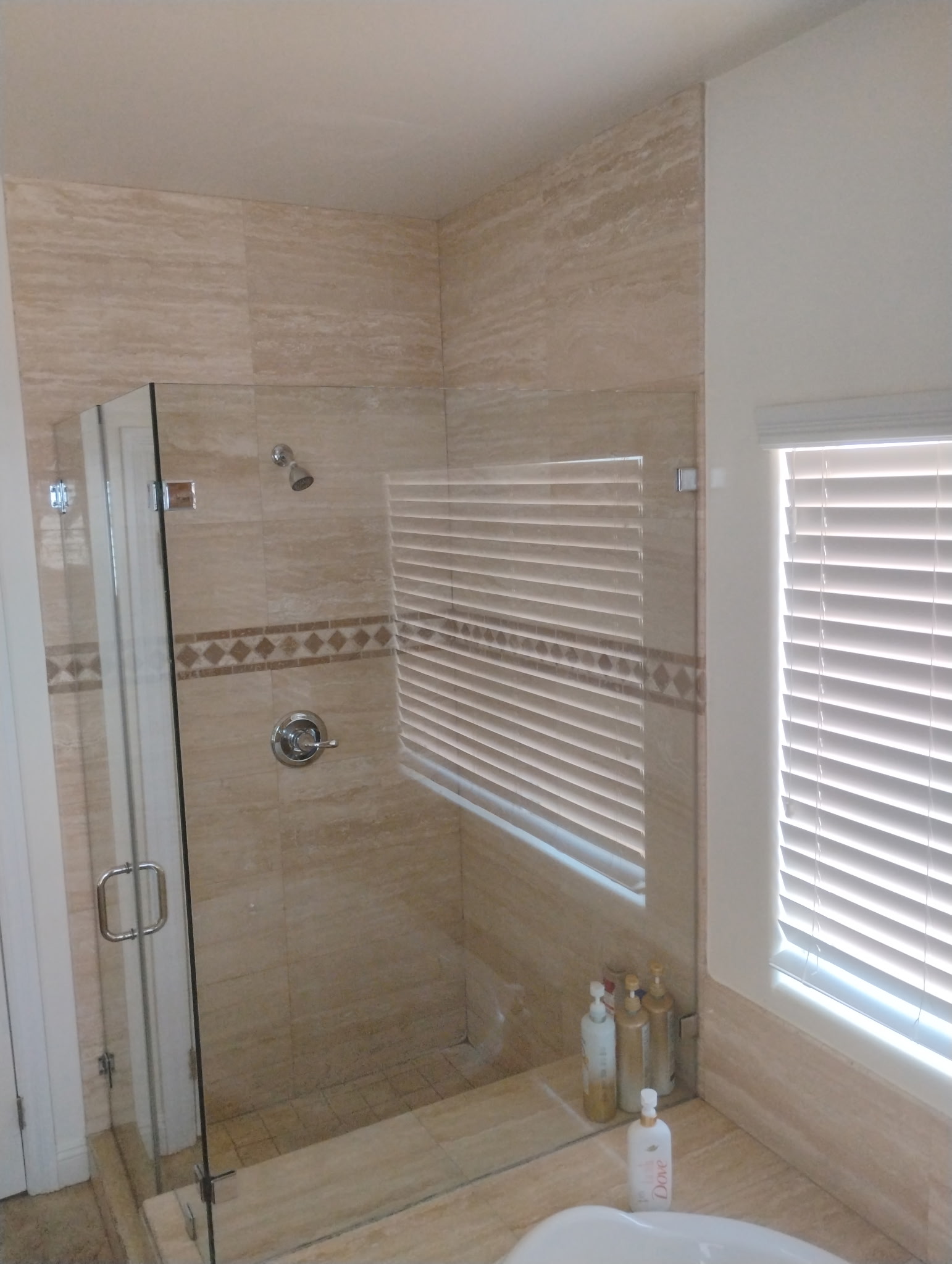 Bright bathroom with a soaking tub and glass shower